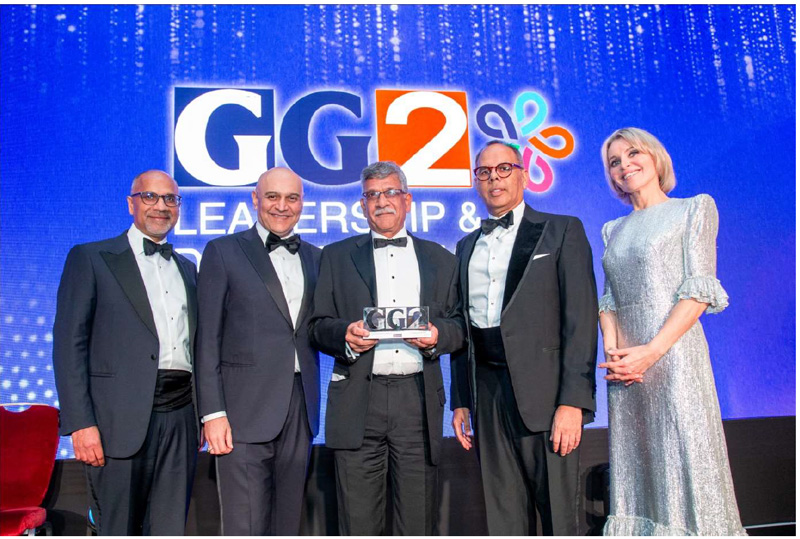 Dr Hadi Manji receiving his award